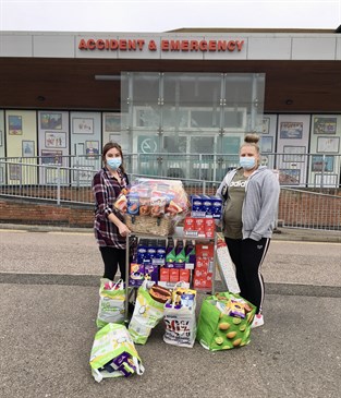 Carlie Waller with Easter Eggs donated to the hospital. She is pictured with another woman outside the QEQM hospital with some of the eggs she has brought for the hospital patients and staff