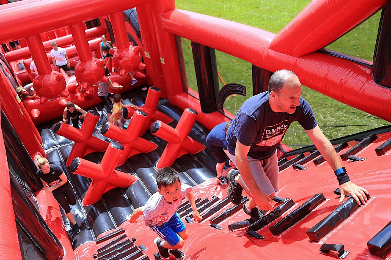 People taking part in the inflatable challenge