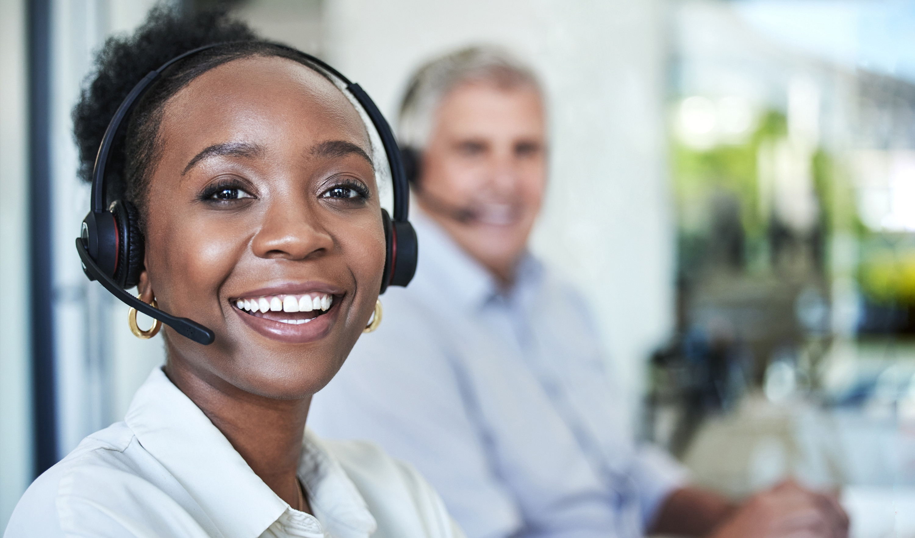 Woman with a headset smiling