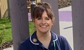 Avatar of Abbi Smith, cancer clinical nurse specialist. Image is a head and shoulders shot of her outside. She is wearing dark blue uniform.