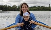Avatar Anna Slark and daughter Amber. Image shows them sitting in a rowing boat on a lake.