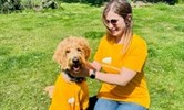 Avatar of Kayleigh and Martha the dog in their orange East Kent Hospitals Charity t-shirts.
