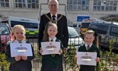 Avatar of the Lord Mayor of Canterbury Pat Todd with the three girls. Image shows Pat standing behind the girls, who are holding certificates. They are pictured outside the hospital.