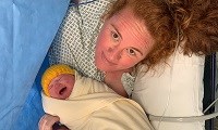 Avatar of Michelle Keen with baby Isabelle. She is pictured in the operating theatre just after Isabelle was born by emergency c-section