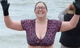 Avatar of Nicola Oakley who did a fundraising Christmas Day sea swim. Image shows her just emerged from the sea wearing a purple patterned bikini and gloves