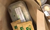 Avatar of some of the meals donated by the Ashford Vineyard project. The photo shows meals in plastic containers in paper bags with cutlery