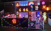Avatar of the Knight family's lights display. Image shows the outside of a house decorated with Christmas lights