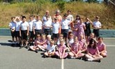 Avatar of children from Monkton school who held a sponsored silence for Rainbow Ward. Image shows children sitting outside wearing school uniform.