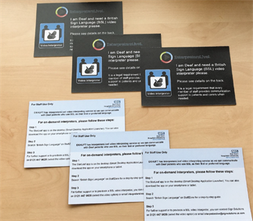 Deaf cards for interpreters service. Image shows front and back of the cards, laid out on a table