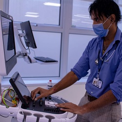 A doctor using the intensive care echo machine.