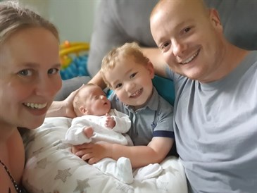 Photo of Mark and Justine Batley with baby son Thomas and his big brother