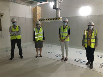Susan Acott and staff inside the new building