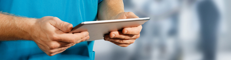 Doctors hands holding electronic tablet