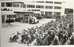 Crowds at the opening of the Kent and Canterbury Hospital in 1937. Black and white image shows the art deco main hospital building with balcony and crowds gathered outside.