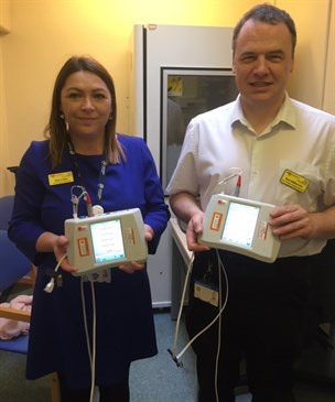 Chief audiologist Karen Dyer and senior audiologist Paul Sillibourne with the devices