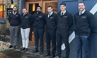 Avatar of Kent Construction Consultants who are doing the Tough Mudder Challenge.  Image shows a group of men standing outside a building