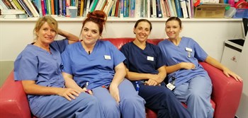 Midwives enjoy relaxing on one of their new sofas