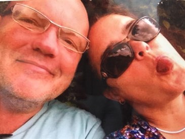 Rani Ullyet with her late husband Chris. It is a selfie, their heads are together and she is poking her tongue out. She is fundraising for Myeloma UK in his memory.