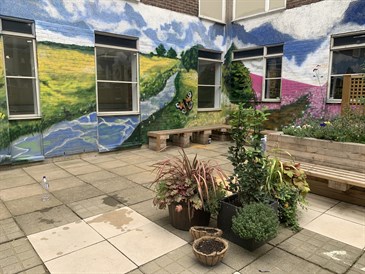 The mural on the walls of the ITU garden at the William Harvey Hospital
