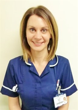 Gemma Millen. Image shows her from the waist up wearing a nurse's uniform