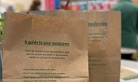 Avatar of paper bags. Image shows the top of two brown paper bags, used in pharmacy instead of plastic bags