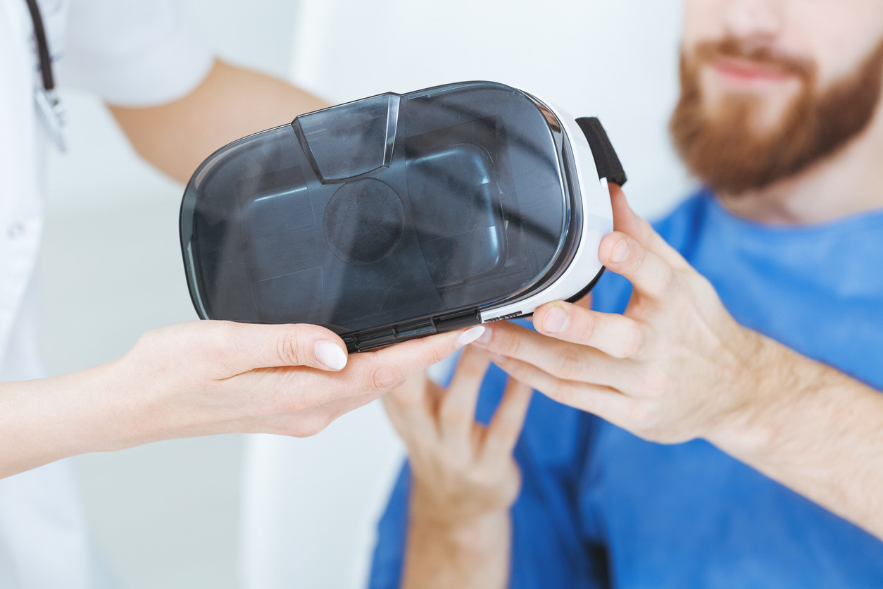 Patient is handed a VR headset