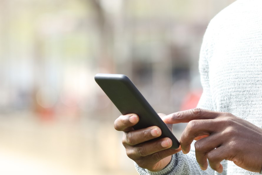 Person taps on a mobile phone