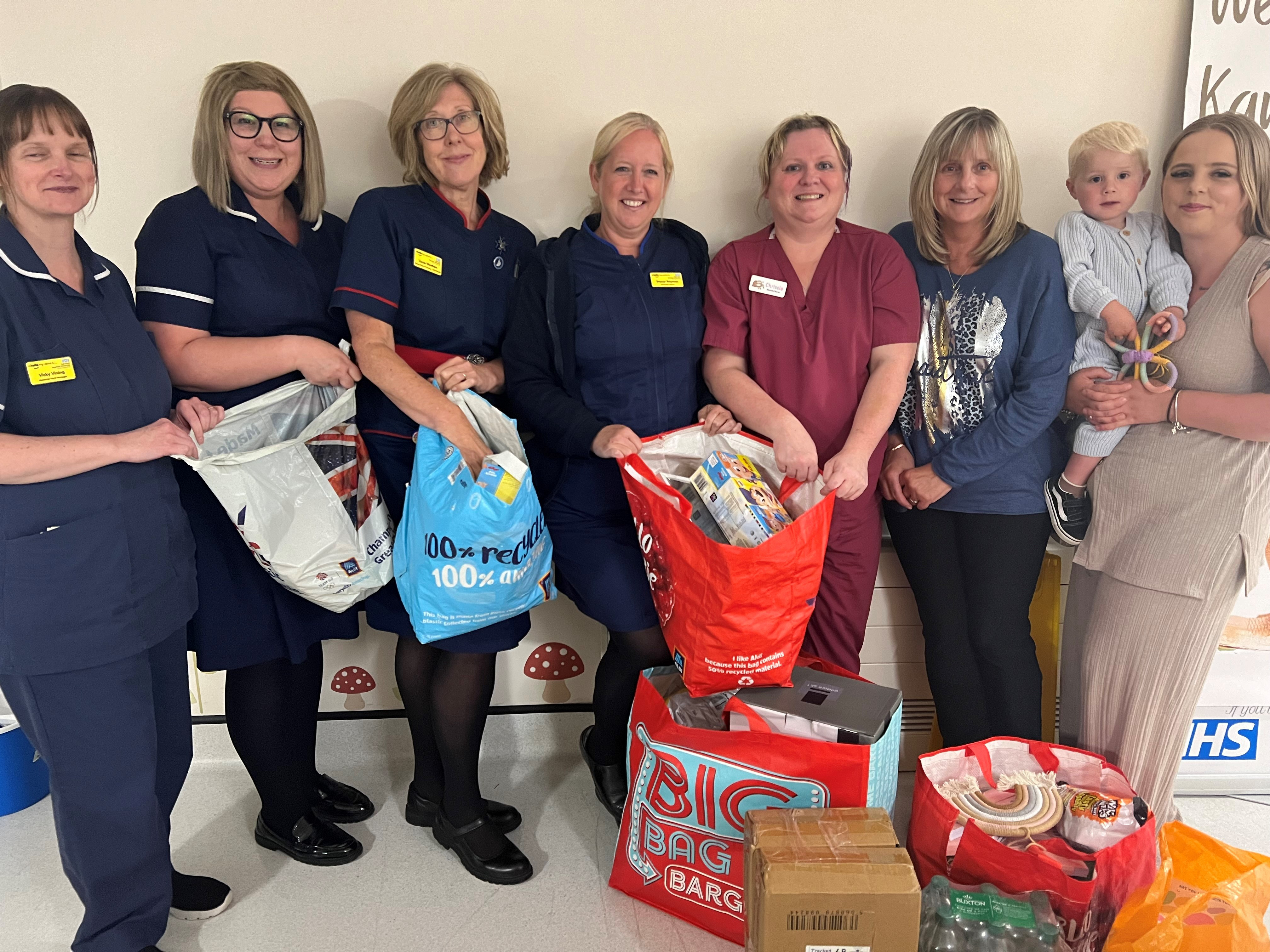Alisha Sharman and Amanda Nicholson with staff from NICU and their donations