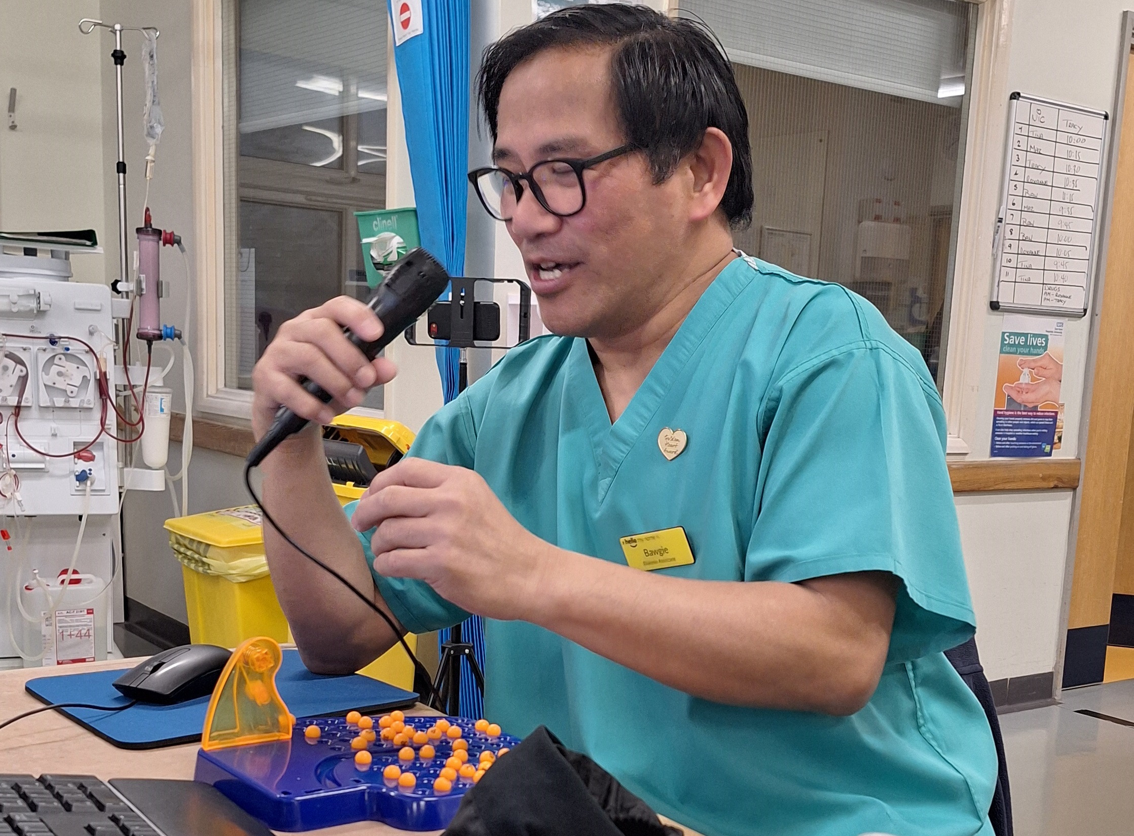 Bawgie Ilar calling out bingo numbers during one of his sessions on the dialysis unit