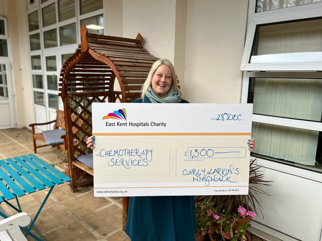 Carly Larkin with a giant cheque for £1,300