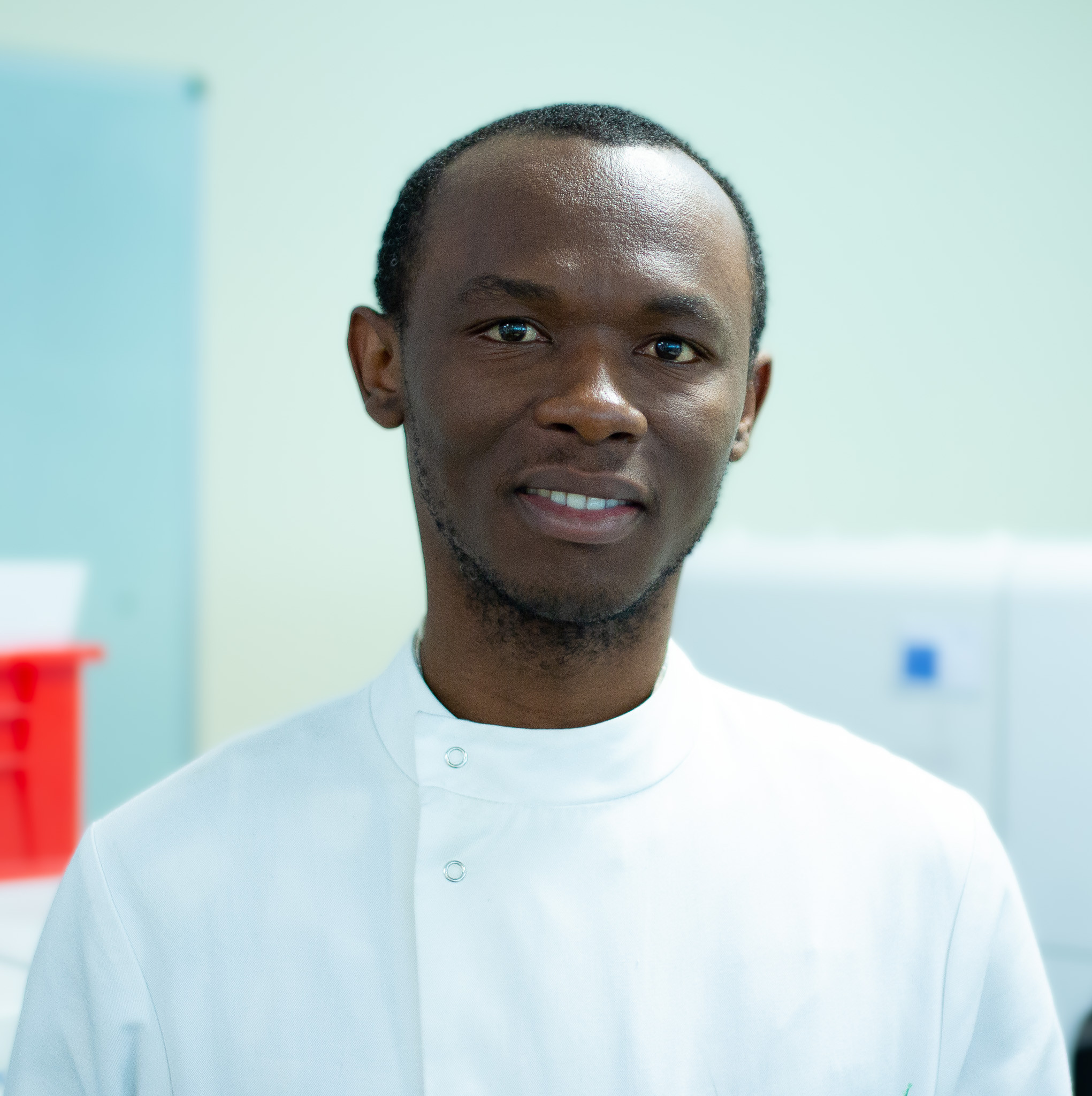 Charles Okafor, pictured wearing a white lab coat