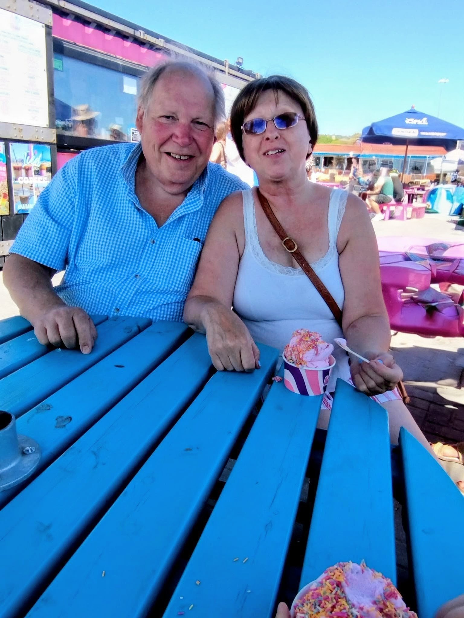 David and Jill Kenward, with an ice cream at a picnic table