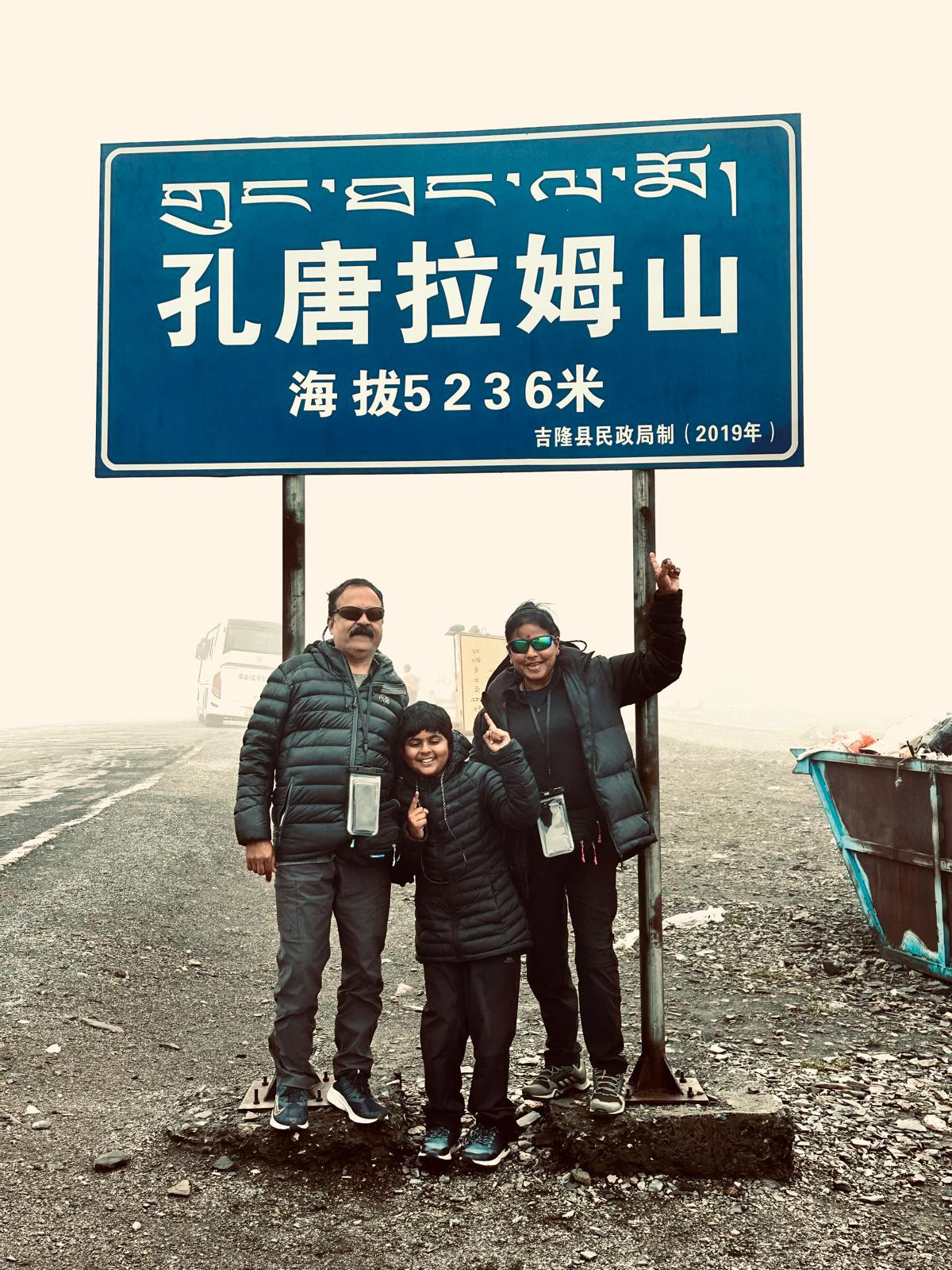 Dr Athmaja Thottungal with her husband and son after conquering the mountain