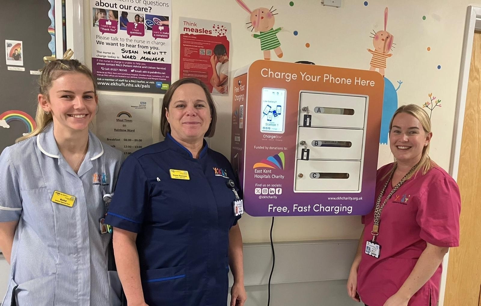 Emma Desmond, centre, with colleagues from Rainbow ward at QEQM and one of the chargeboxes