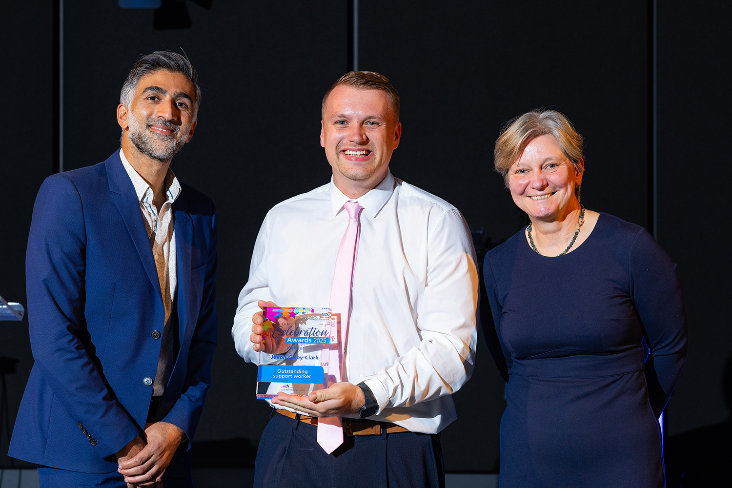 Jevon with Khaleel Desai and Tracey Fletcher. He is holding his award