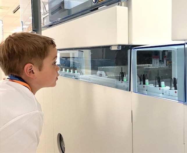 Josh watches samples in the transport system