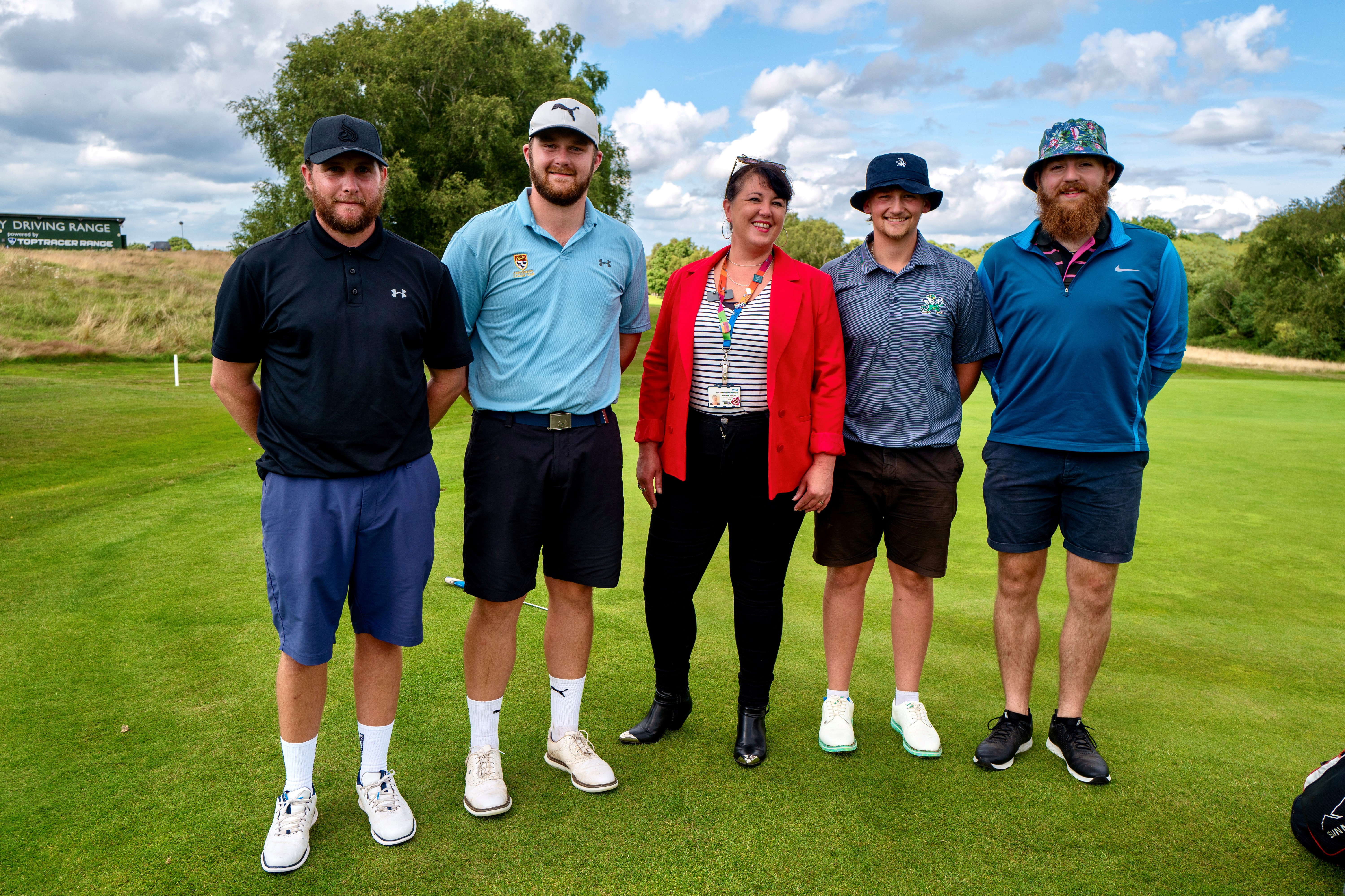 Kai Appleby, Max Rutherford, Alex Beck and Ben Rutherford with Dee Neligan from East Kent Hospitals charity. They are pictured on a golf course, the golfers are wearing hats and shorts.