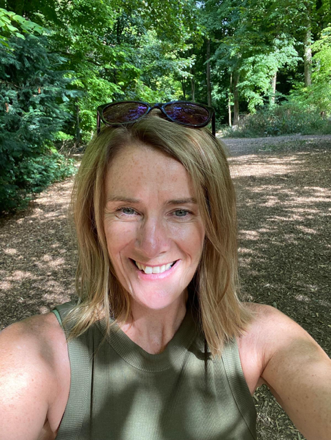 Laura Corby, in a woodland area