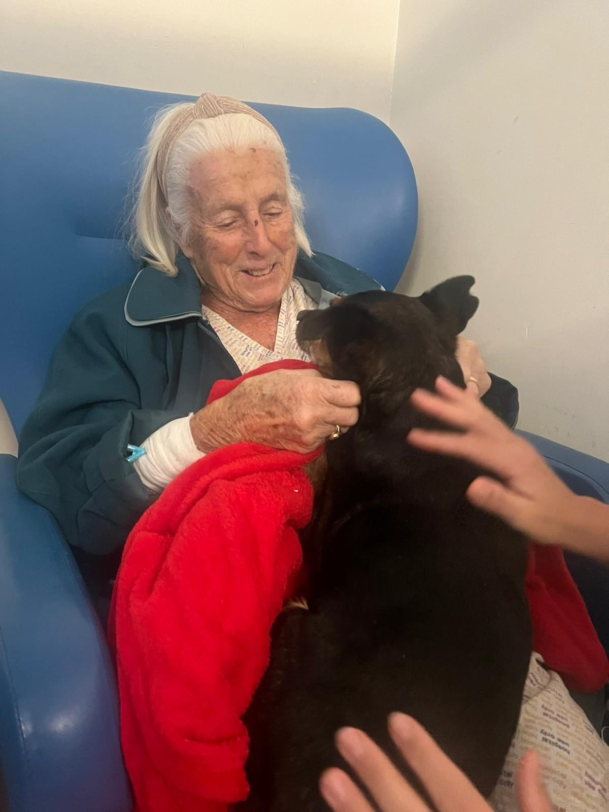 Dora and Maddie enjoy a cuddle in hospital