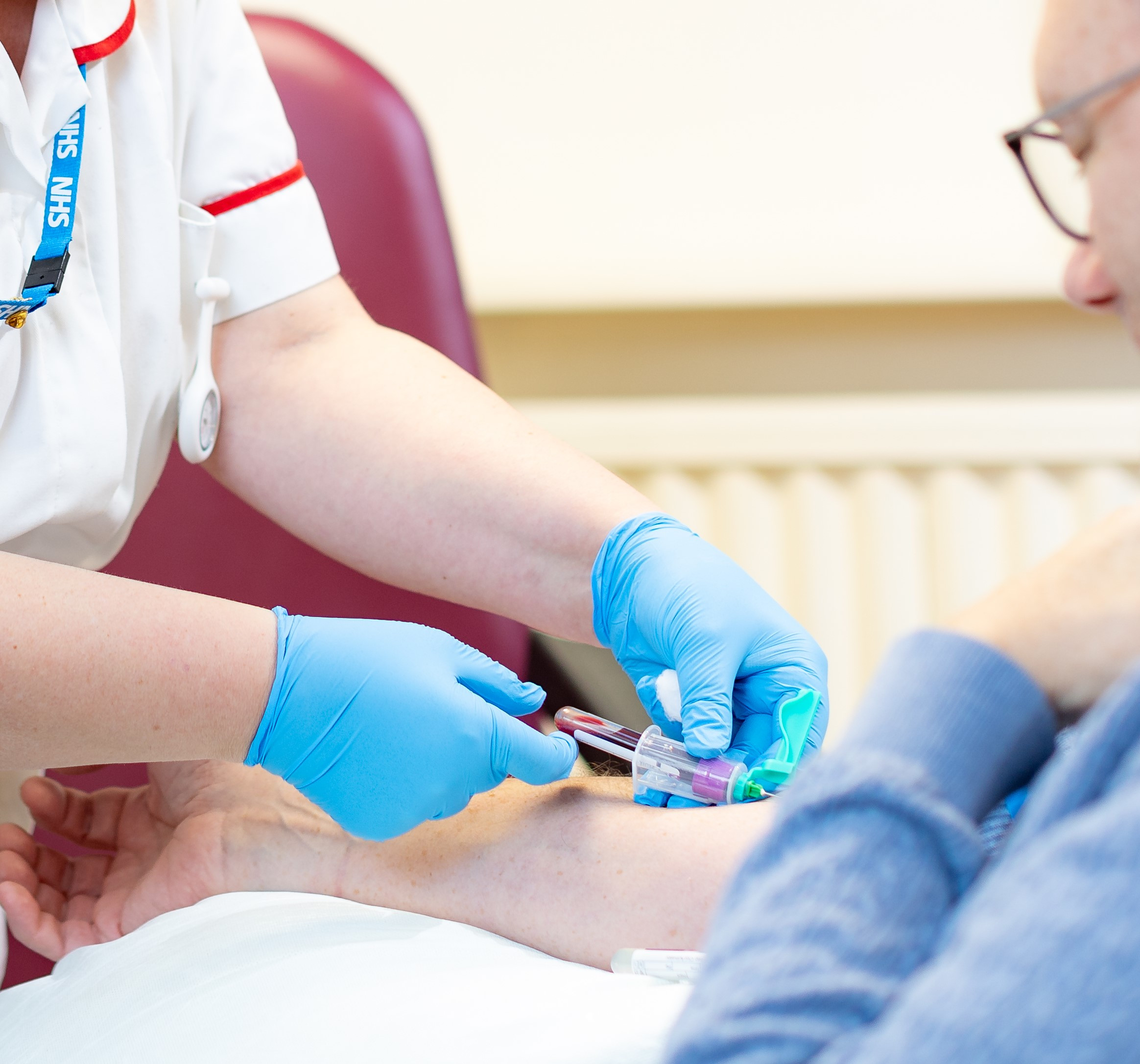 stock photo shows phlebotomist taking blood test