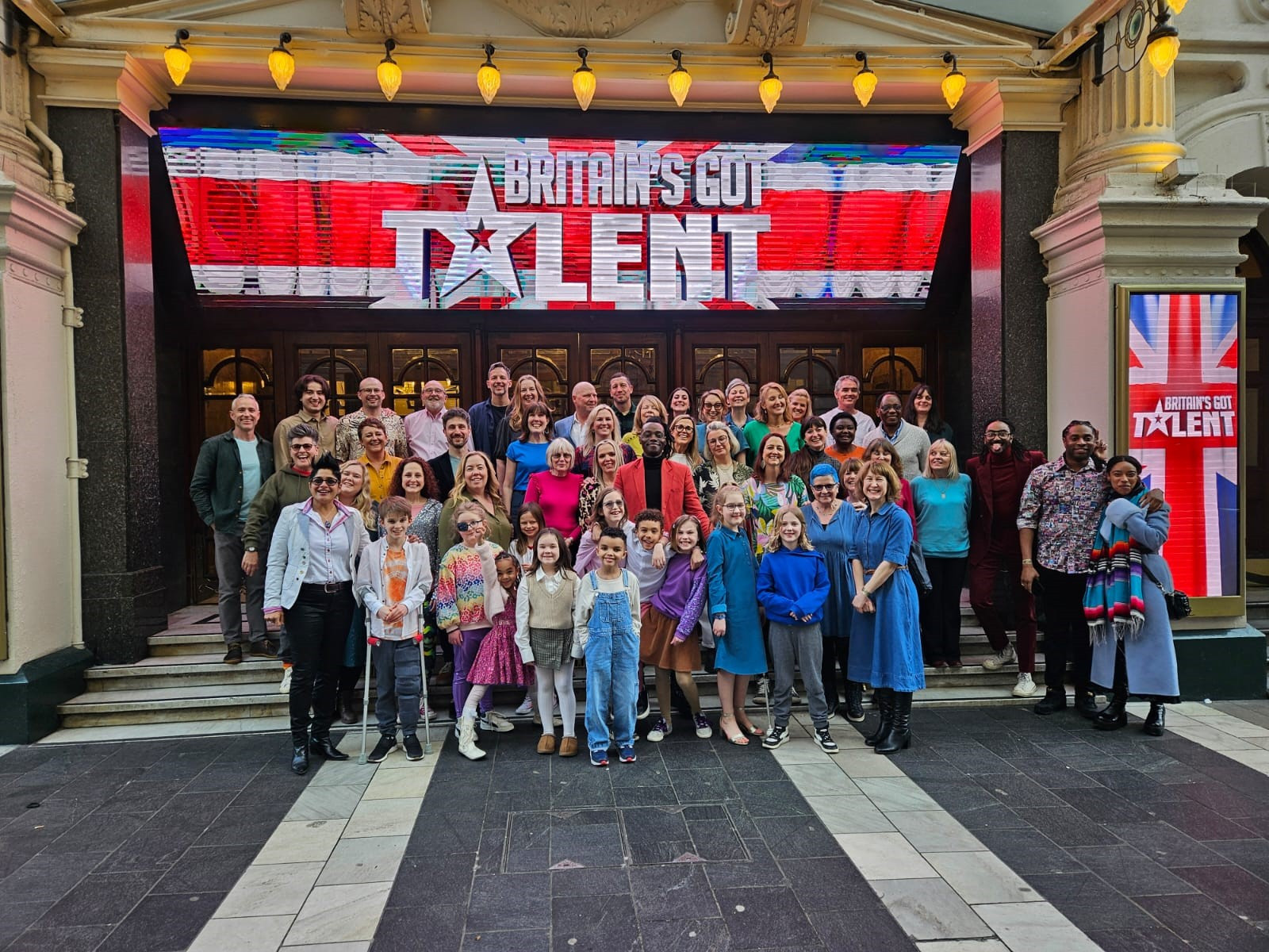 Ravi's Dream Team outside the theatre after recording their B GT audition. Samuel is front row left on crutches
