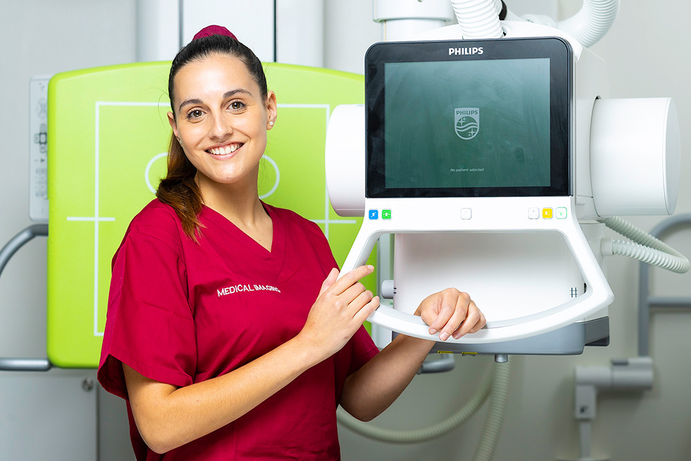 Ana Racquel Garces with an X-ray machine